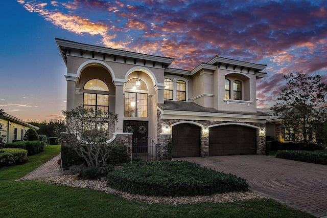 view of front of property with a garage and french doors