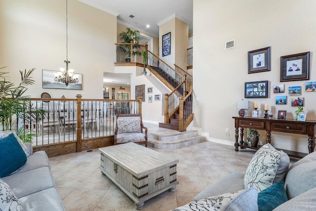 living room featuring a notable chandelier, crown molding, light tile patterned floors, and a towering ceiling