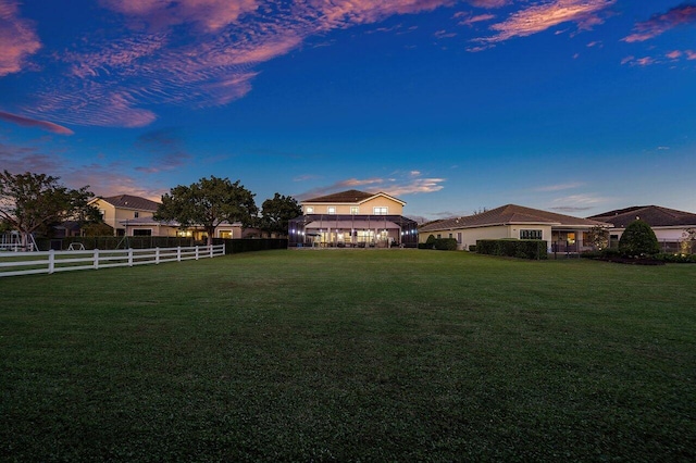 view of yard at dusk