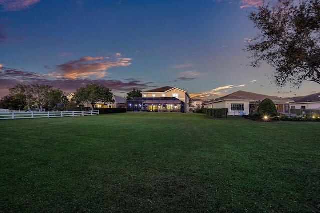 view of yard at dusk