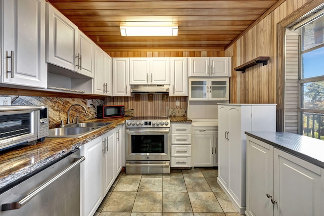 kitchen with stainless steel appliances, sink, white cabinets, and wood ceiling