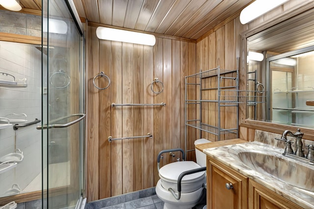 bathroom featuring wooden walls, vanity, a shower with shower door, wooden ceiling, and toilet