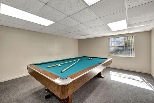 recreation room featuring pool table, a paneled ceiling, and dark carpet