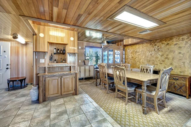 dining room with wood ceiling