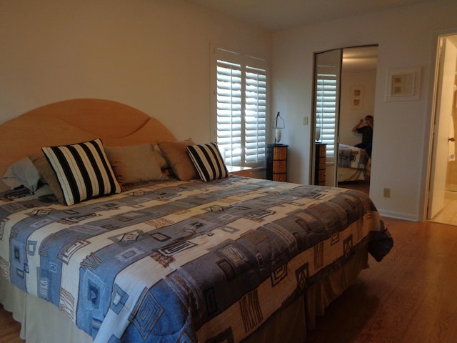 bedroom featuring hardwood / wood-style floors