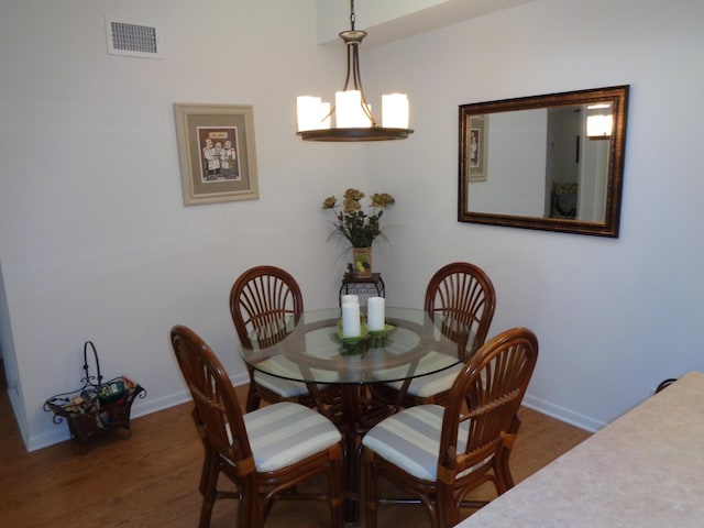 dining space featuring dark hardwood / wood-style floors