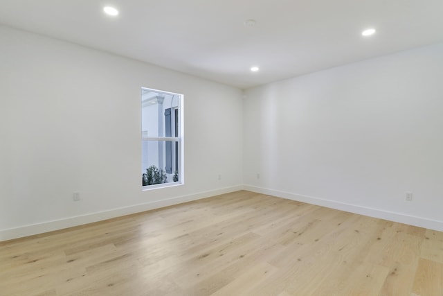 spare room featuring light hardwood / wood-style floors