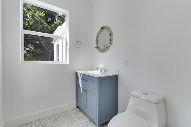 bathroom with vanity and toilet