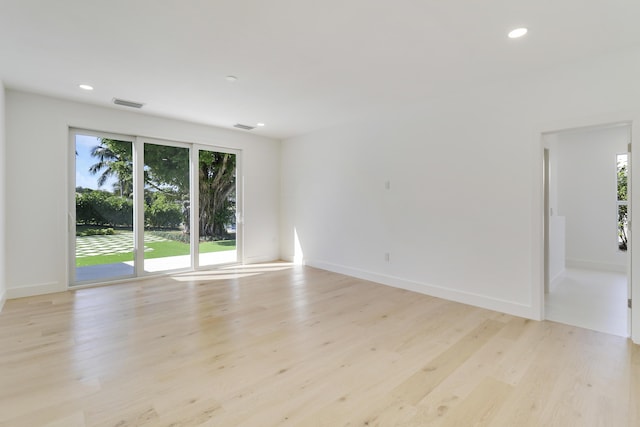 unfurnished room with light hardwood / wood-style flooring