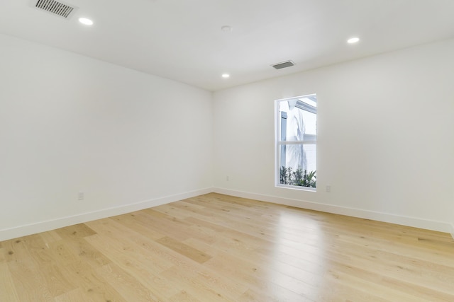 unfurnished room with light hardwood / wood-style flooring