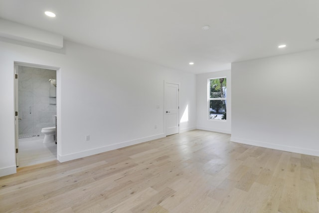 spare room with light hardwood / wood-style flooring