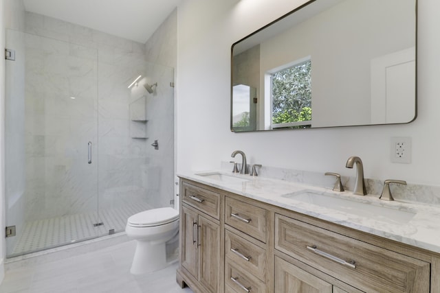 bathroom with vanity, an enclosed shower, and toilet