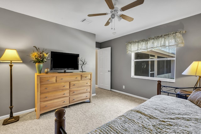 bedroom featuring light colored carpet and ceiling fan