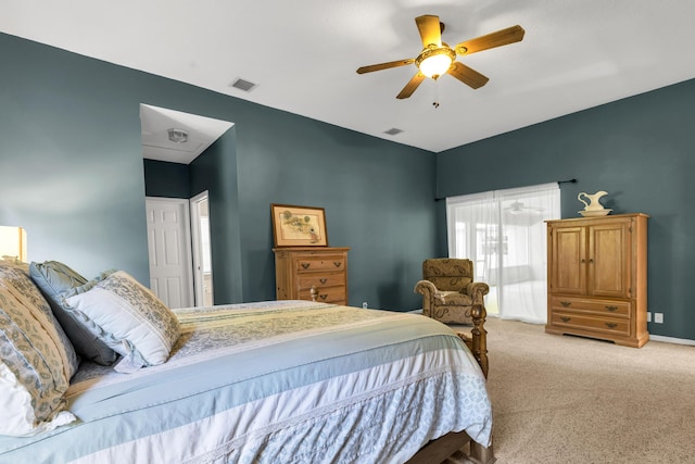 carpeted bedroom featuring baseboards, visible vents, and a ceiling fan