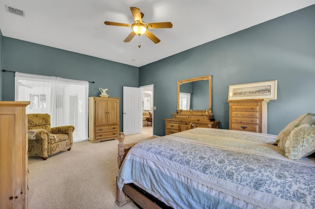 bedroom with ceiling fan and light carpet