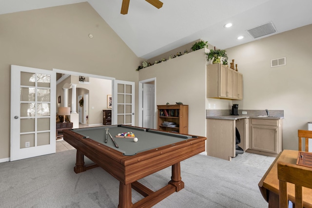 playroom with french doors, light colored carpet, ceiling fan, and high vaulted ceiling