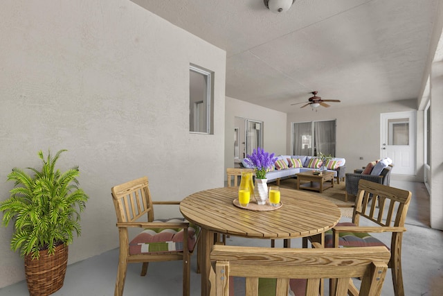 dining room featuring concrete floors and ceiling fan