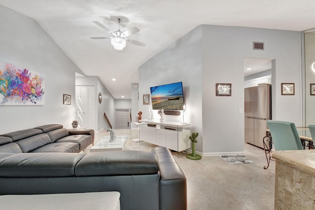 living room featuring light tile patterned flooring, lofted ceiling, and ceiling fan