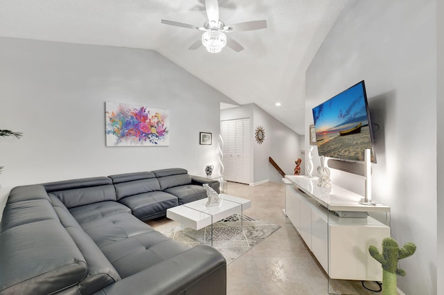 living room featuring ceiling fan and lofted ceiling