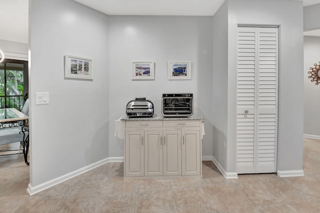 hallway with light tile patterned flooring