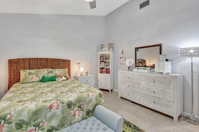 tiled bedroom with ceiling fan