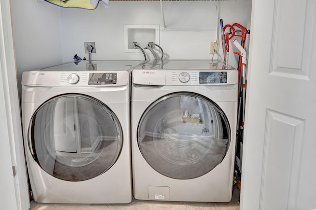 laundry room featuring washing machine and clothes dryer