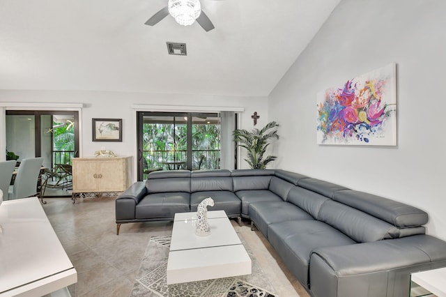 living room with ceiling fan and vaulted ceiling