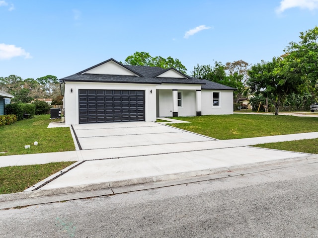 view of front facade with a garage and a front yard