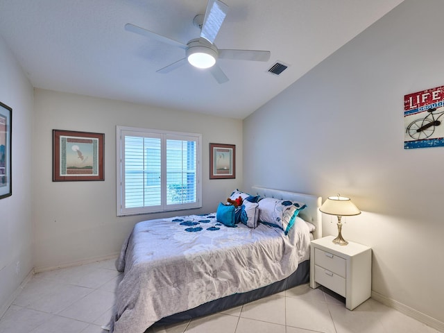 tiled bedroom with ceiling fan