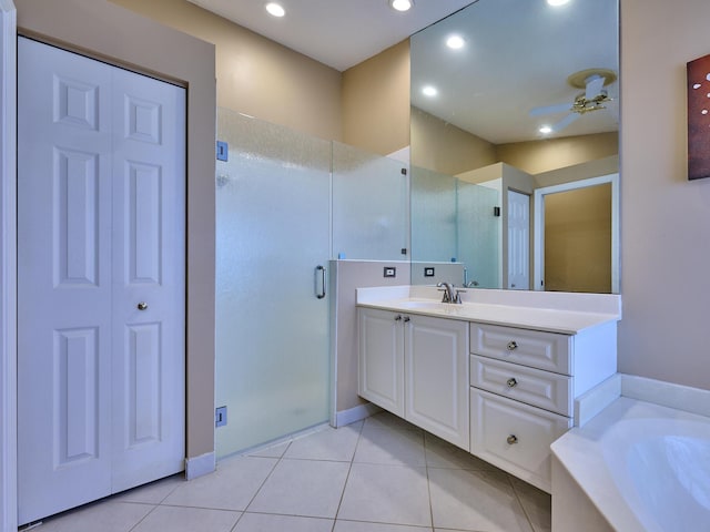 bathroom with tile patterned flooring, vanity, and independent shower and bath