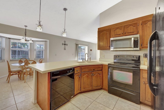 kitchen with black appliances, sink, backsplash, hanging light fixtures, and kitchen peninsula