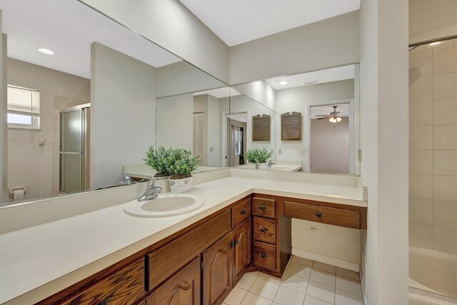 bathroom with tile patterned flooring, vanity, and ceiling fan