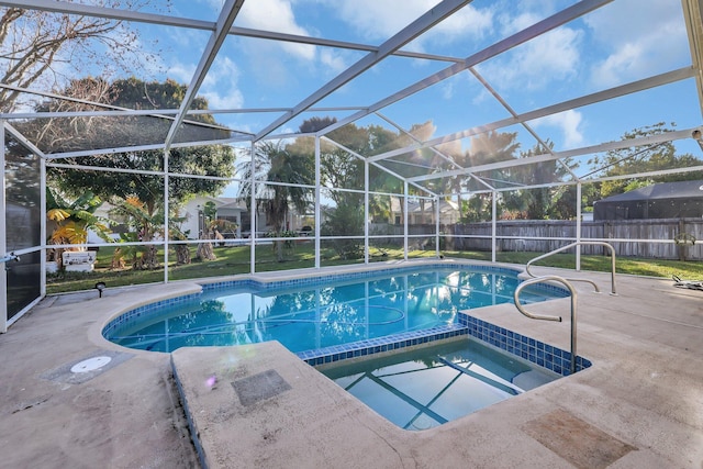 view of pool with an in ground hot tub, a lanai, and a patio area