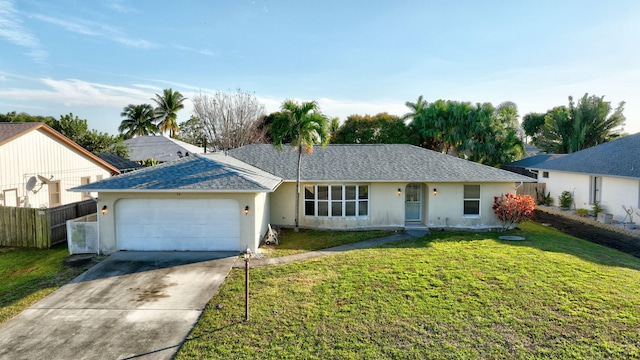 ranch-style home featuring a garage and a front lawn