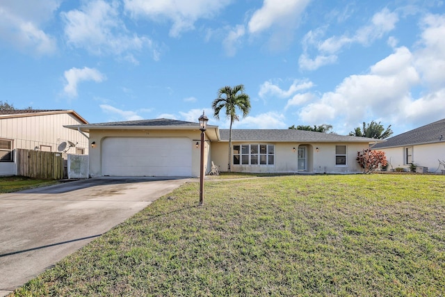 ranch-style home featuring a garage and a front yard