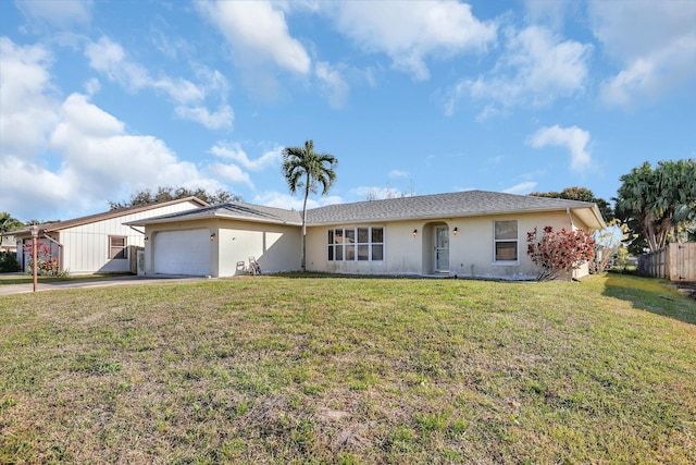 single story home with a garage and a front yard