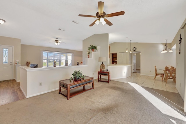 carpeted living room featuring lofted ceiling and ceiling fan