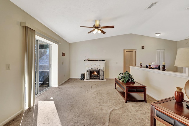 living room featuring light carpet, lofted ceiling, and ceiling fan