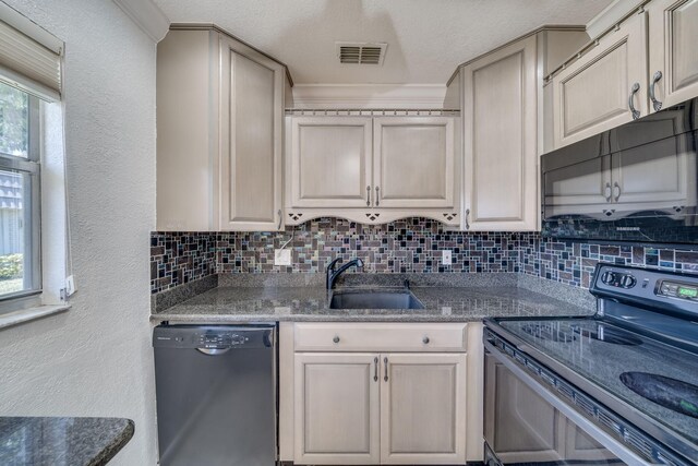 8 Valencia Unit A, Delray Beach, FL 33446 - kitchen with black appliances, a sink, tasteful backsplash, and a textured wall