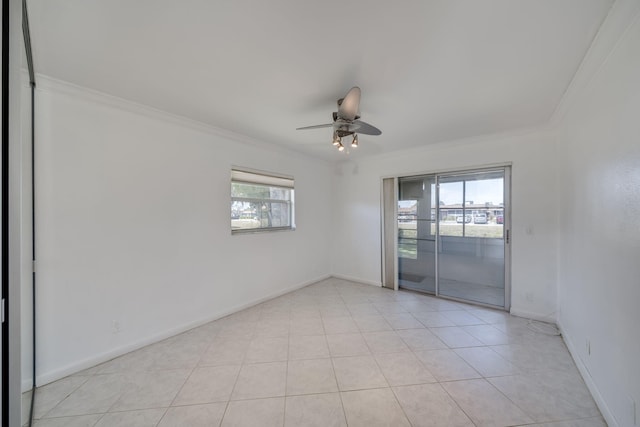 8 Valencia Unit A, Delray Beach, FL 33446 - unfurnished room with healthy amount of natural light, crown molding, a ceiling fan, light tile patterned flooring, and baseboards