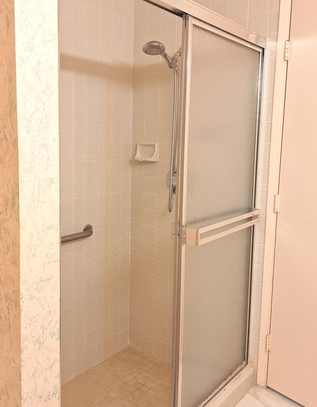 bathroom featuring an enclosed shower