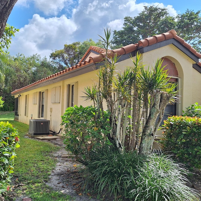 view of home's exterior with cooling unit