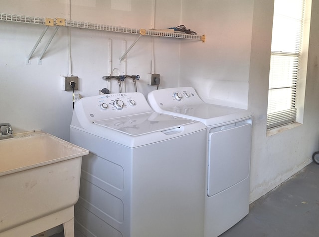 washroom featuring independent washer and dryer and sink