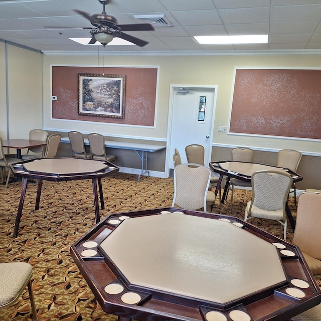 dining space with ornamental molding, a paneled ceiling, and ceiling fan