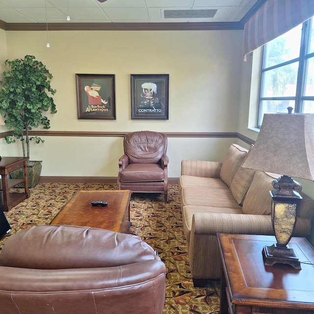 living room featuring crown molding