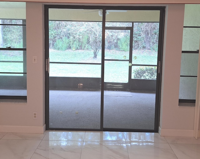 entryway with light tile patterned flooring