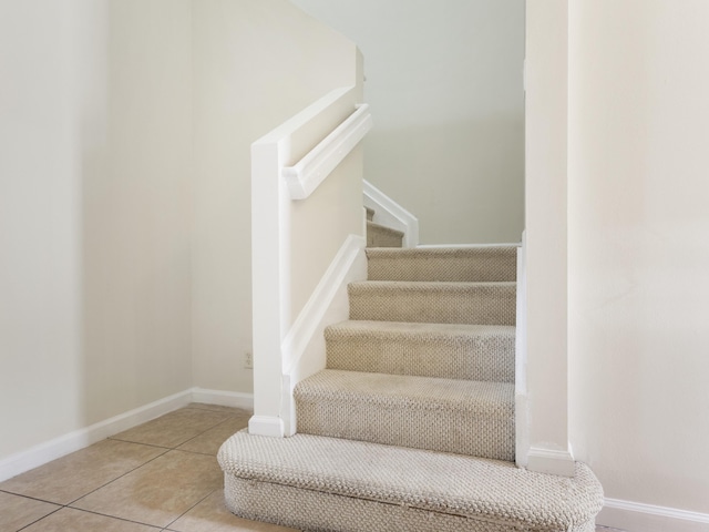 stairs featuring tile patterned floors