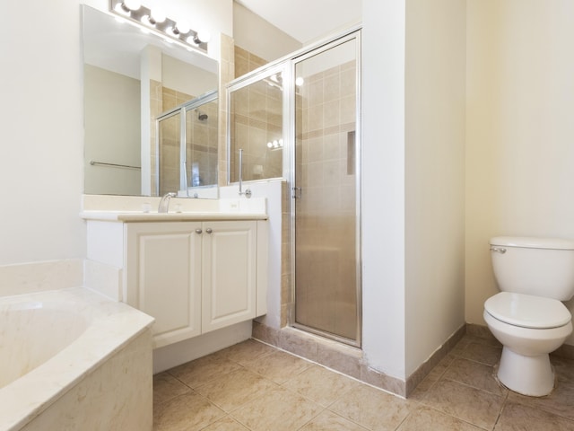 full bathroom featuring tile patterned flooring, shower with separate bathtub, and toilet