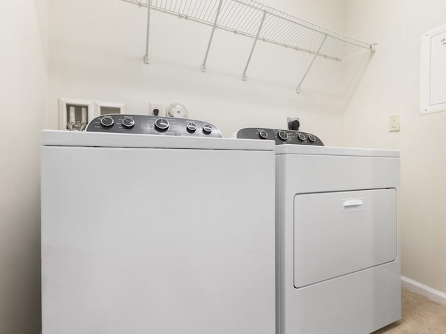 clothes washing area with washing machine and clothes dryer