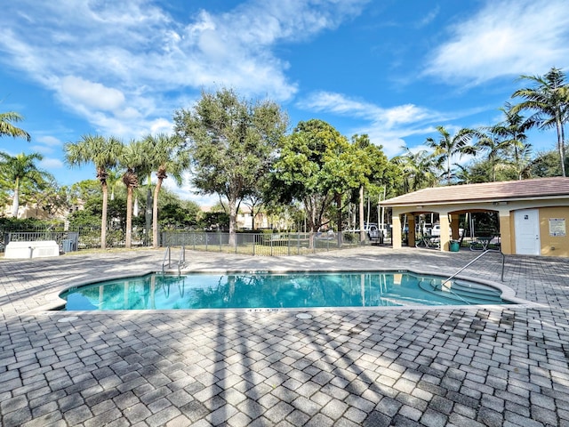 view of pool featuring a patio area